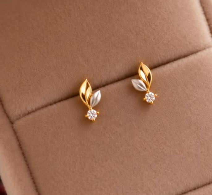 Gold and silver tone leaf stud earrings