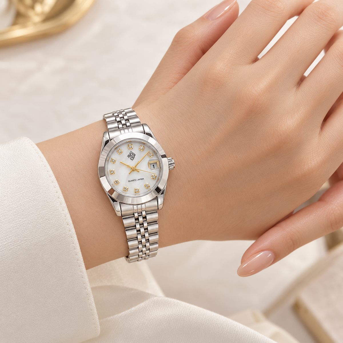 Petite NSJ women's silver watch worn on female model hand