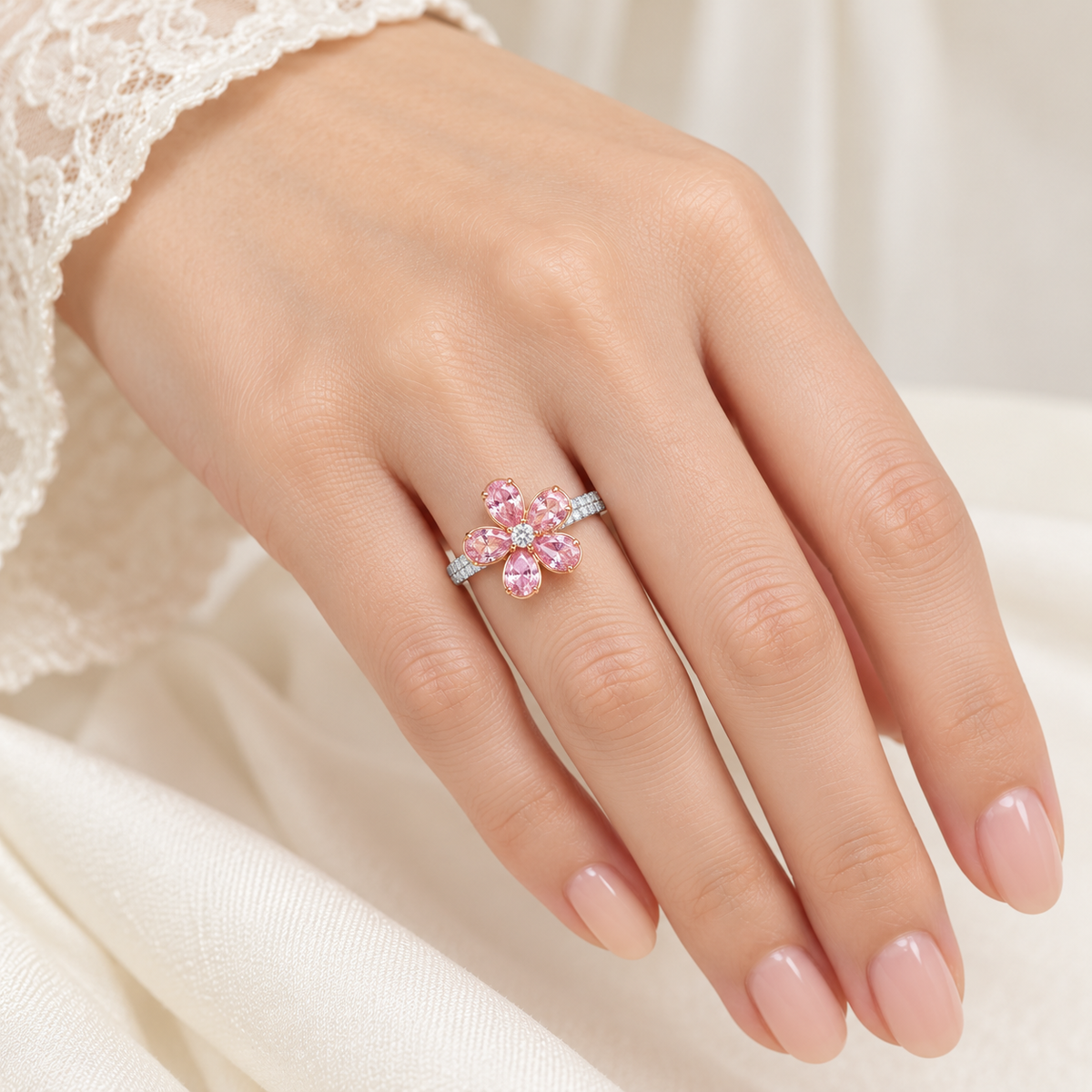 Blush pink flower ring worn on model hand