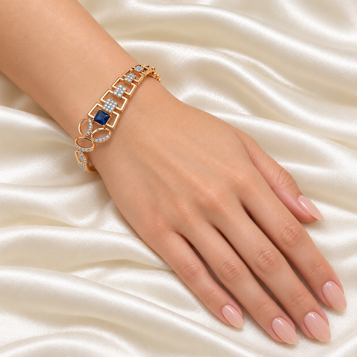 Blue Square Geometric Kada — Golden on a single model wrist with nails visible