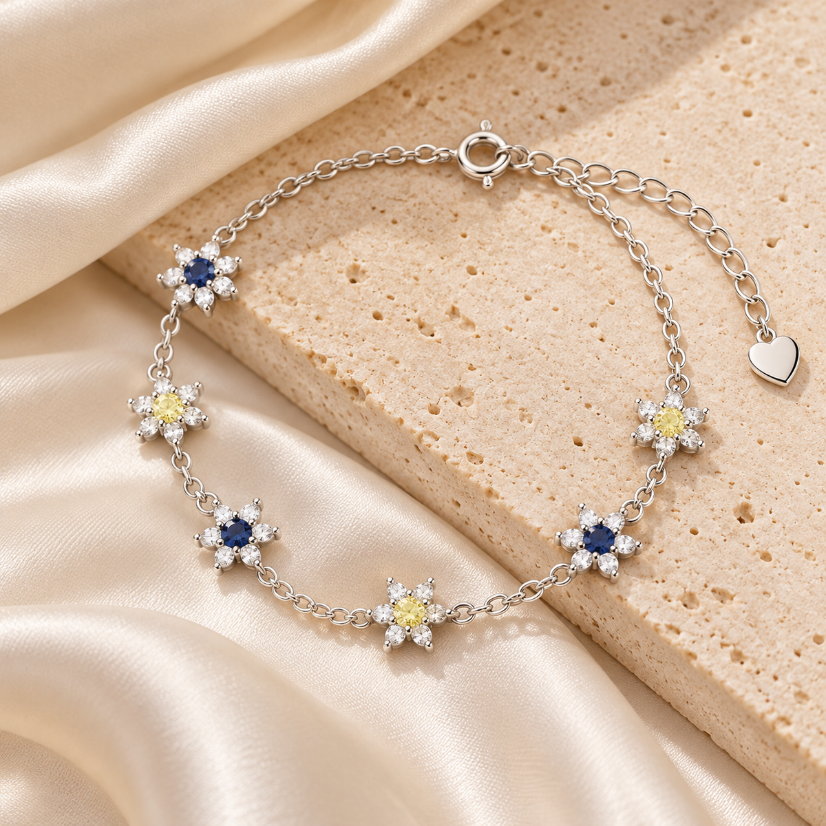 Blue and yellow floral bracelet on ivory satin and stone