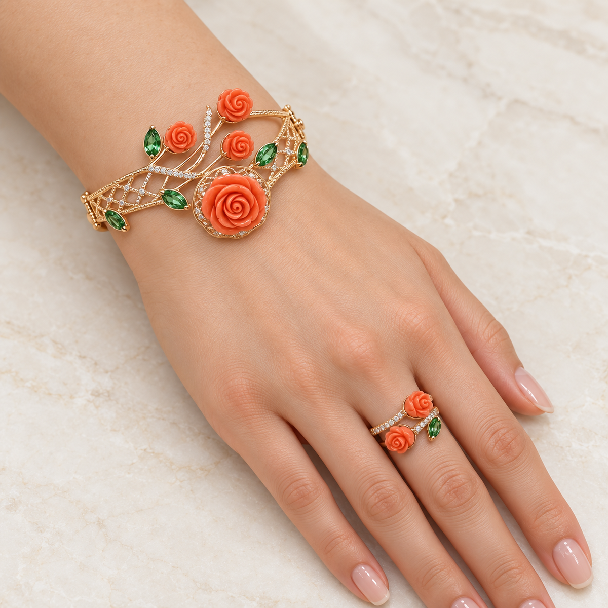Rose gold coral rose bracelet and ring on model hand