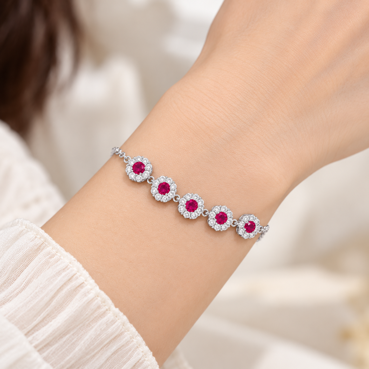 Silver floral halo bracelet on model wrist