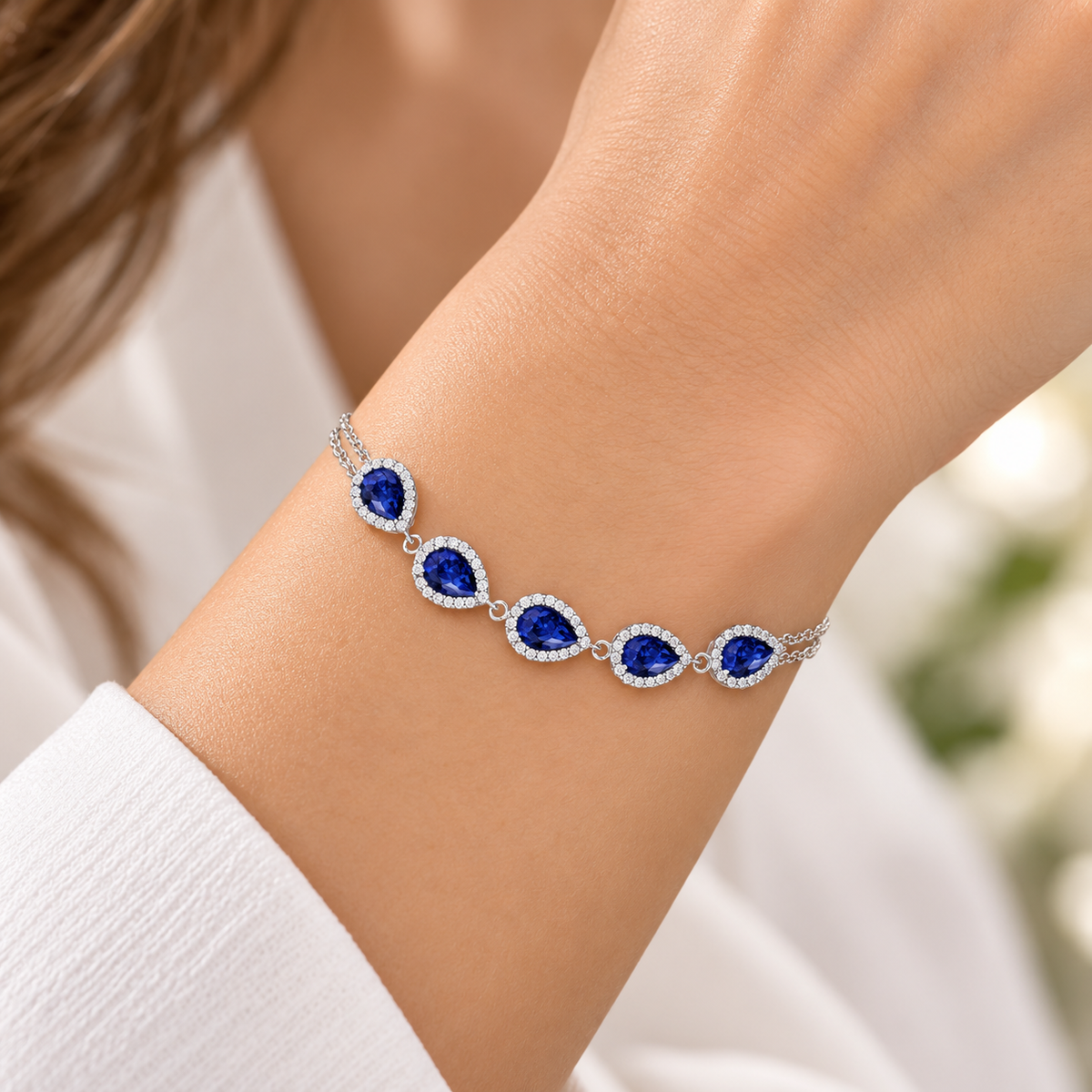 Silver blue teardrop bracelet worn on model