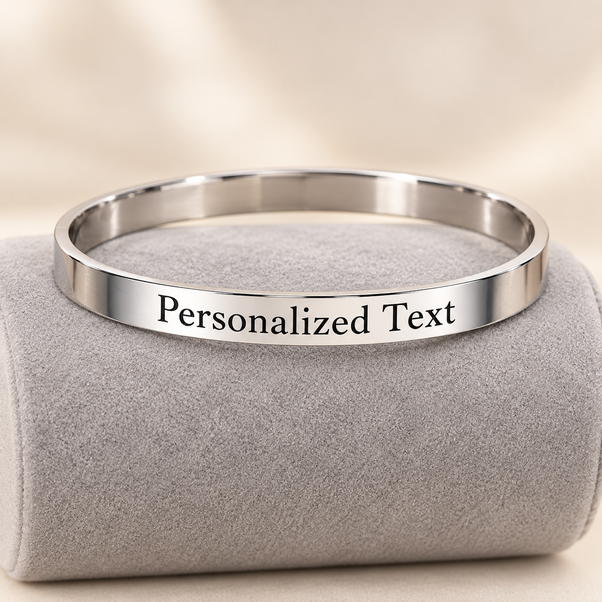 Personalized silver kada on grey suede display