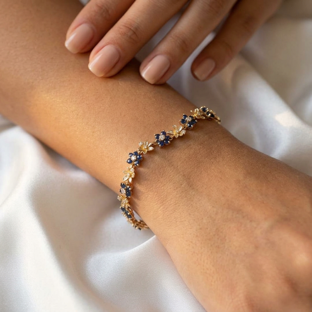Sapphire Flower Bracelet worn on wrist with white silk background