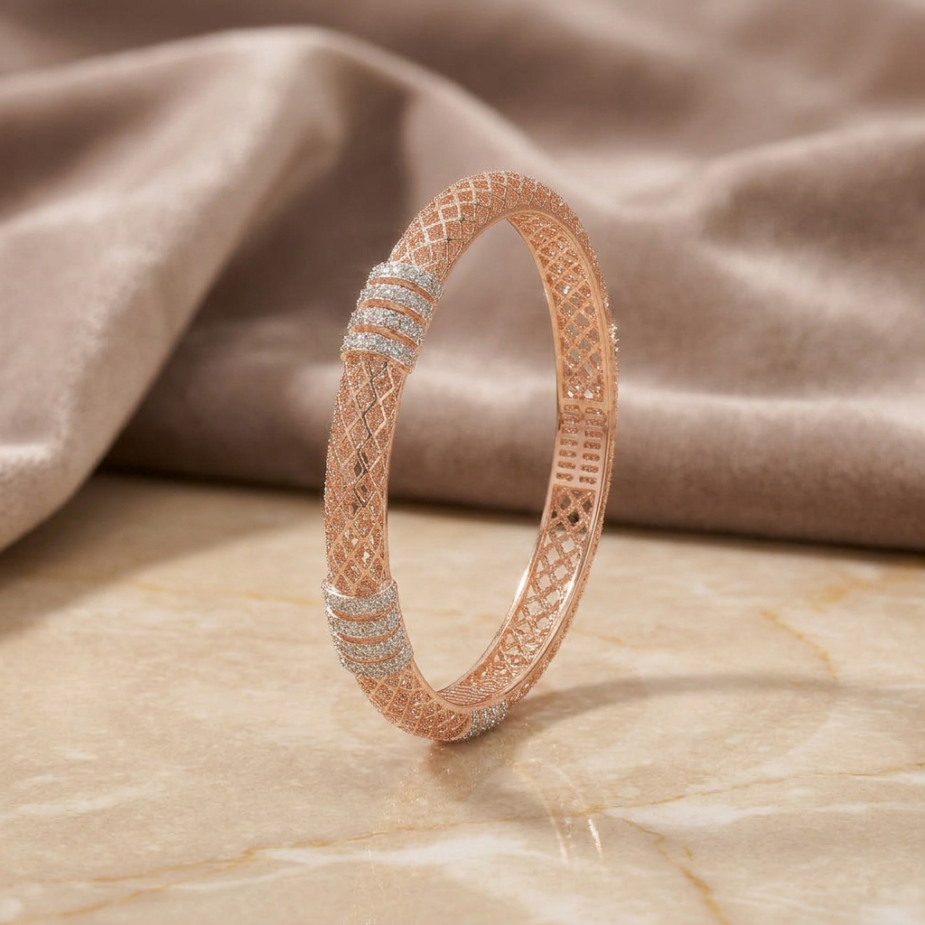 Rose Gold Mesh Lattice Bangle upright on cream marble with silk background