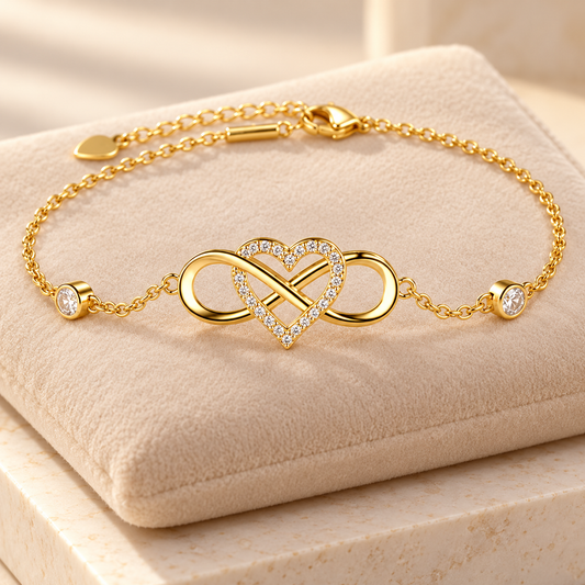 Golden infinity heart bracelet on beige velvet cushion
