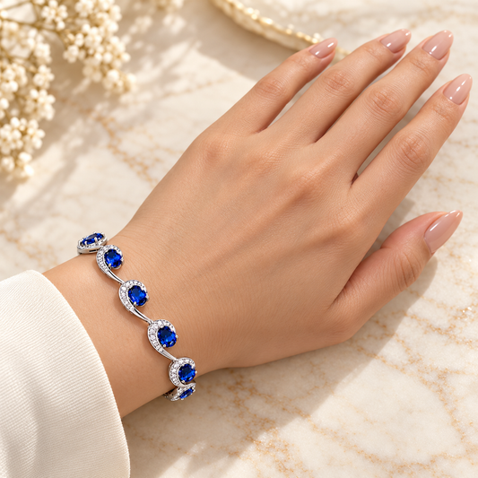 Bracelet original design on full model hand with nude manicured nails