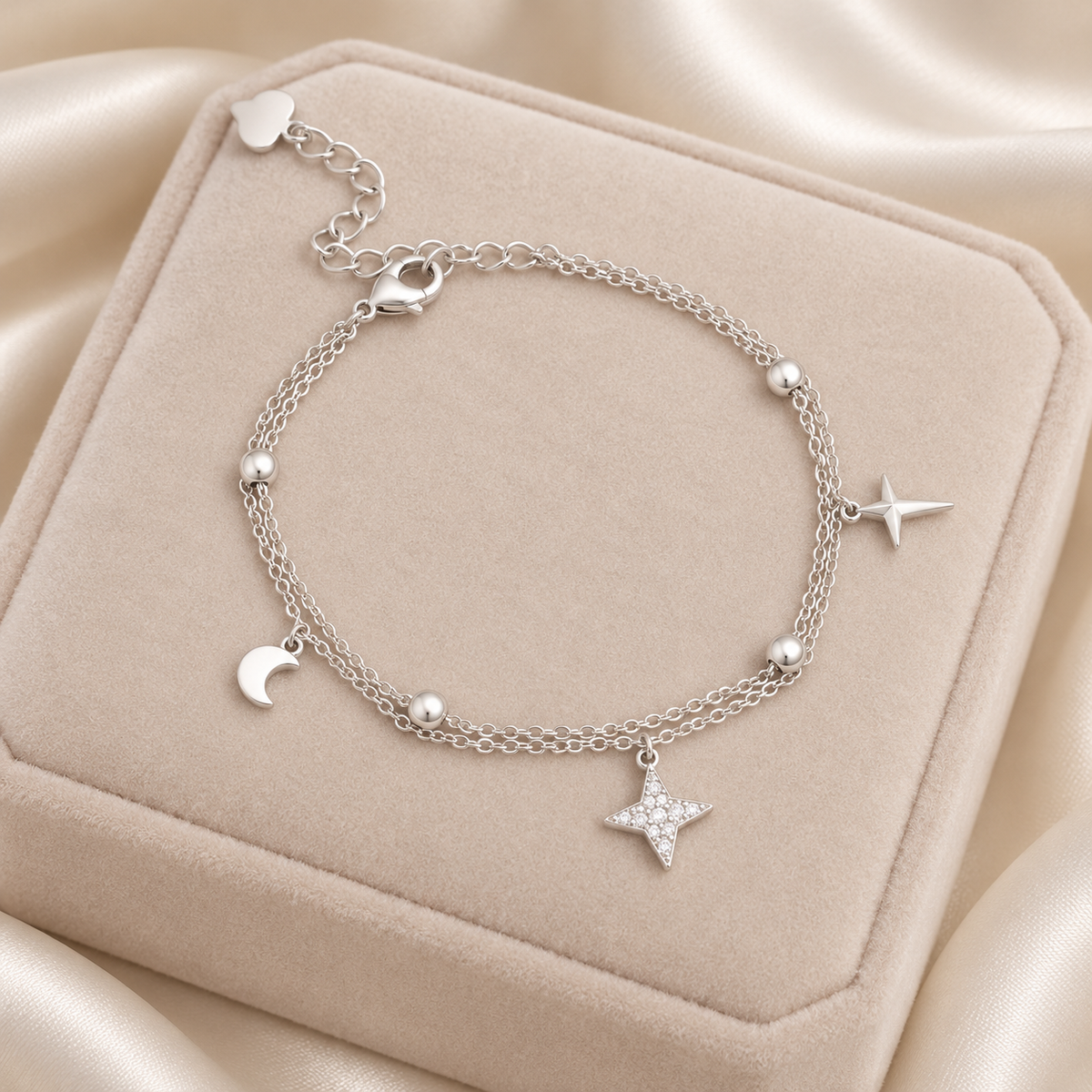 Silver Moon & Star Double Chain Bracelet on velvet display