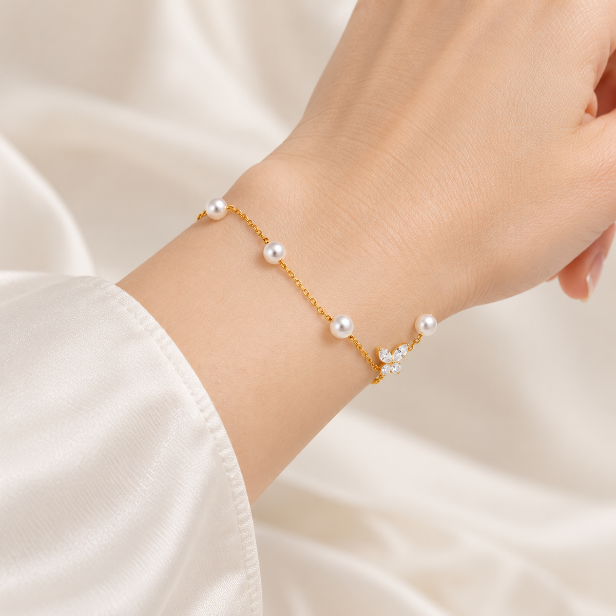 Golden Pearl Butterfly Bracelet on model wrist