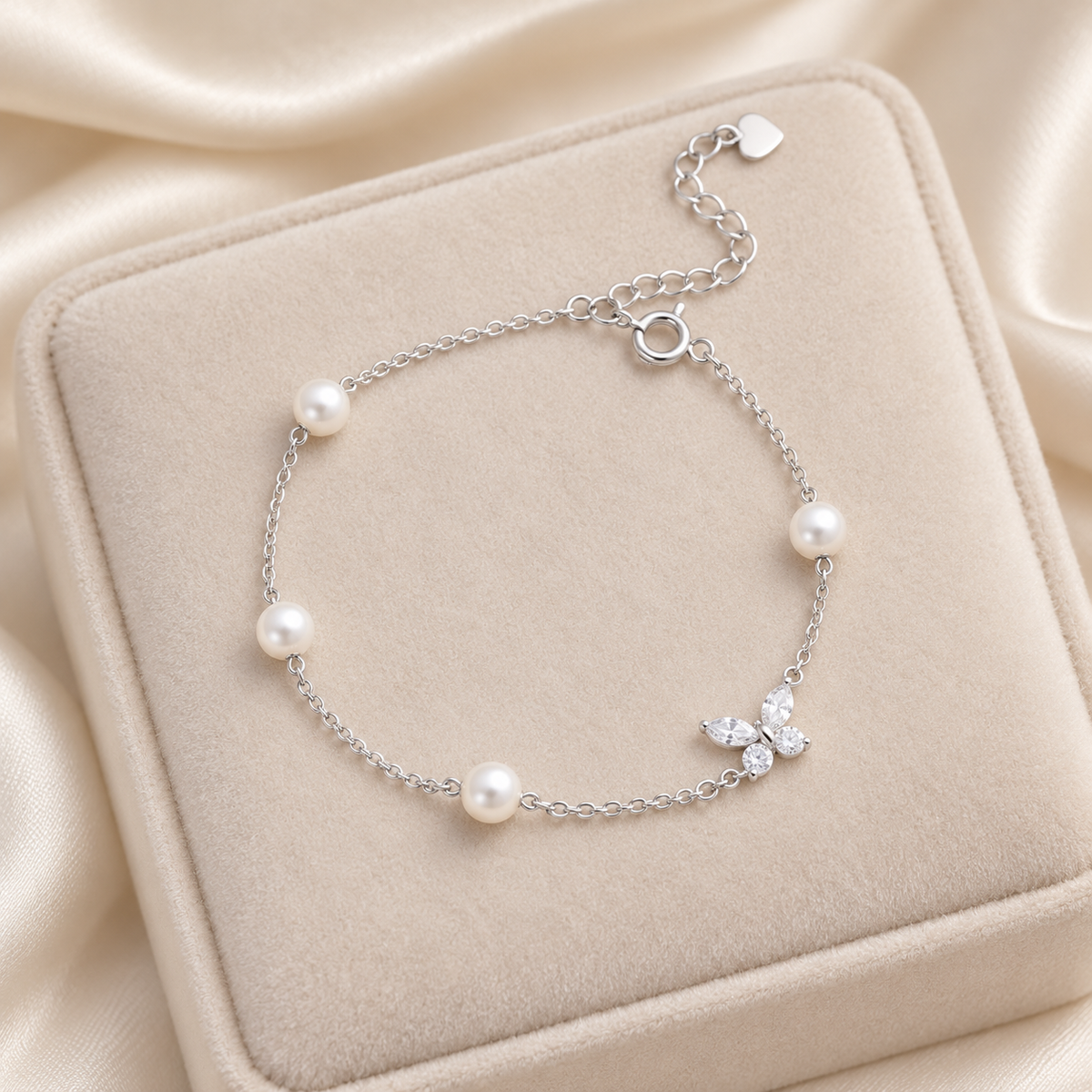 Silver Pearl Butterfly Bracelet on velvet display