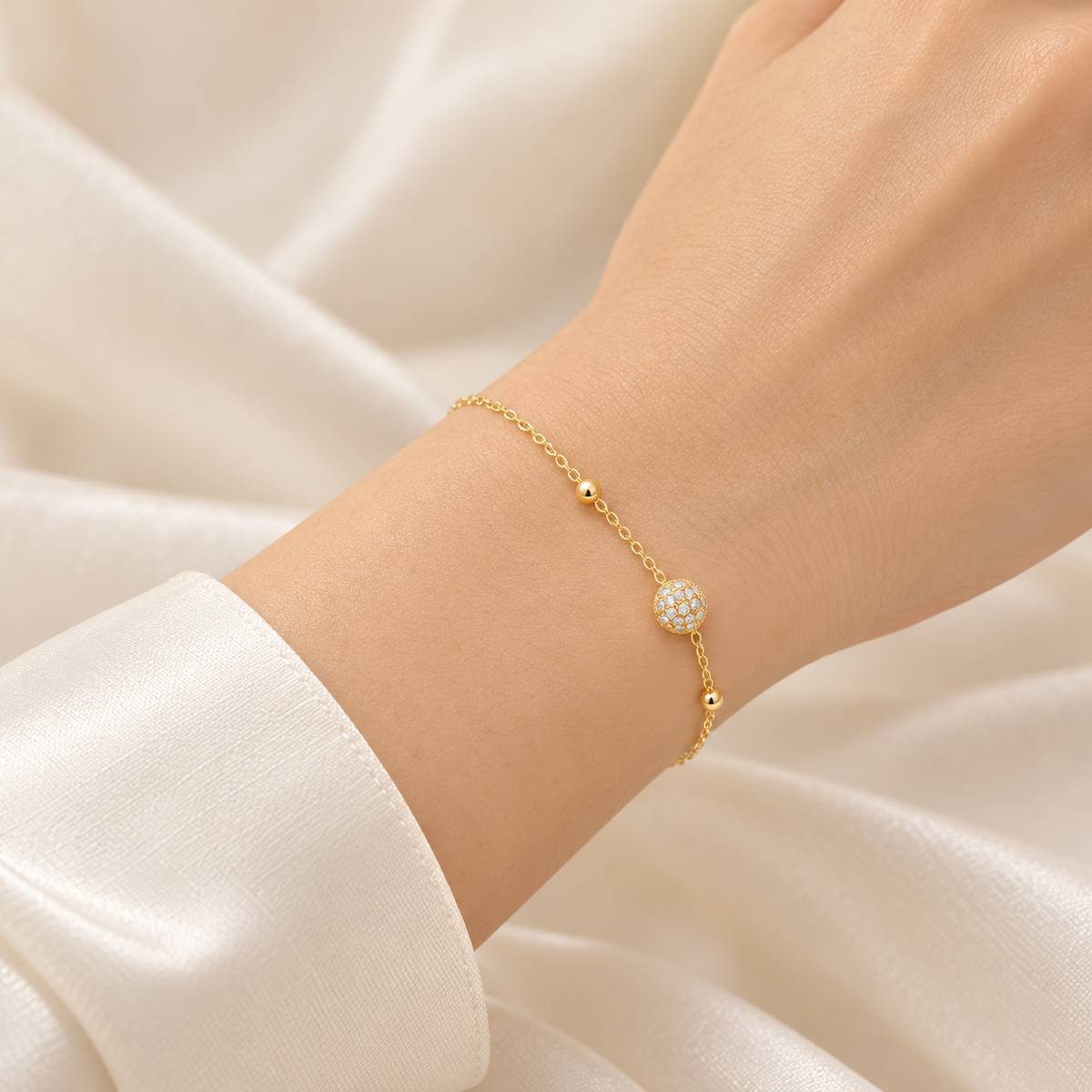 Golden Pavé Ball Bracelet on model wrist