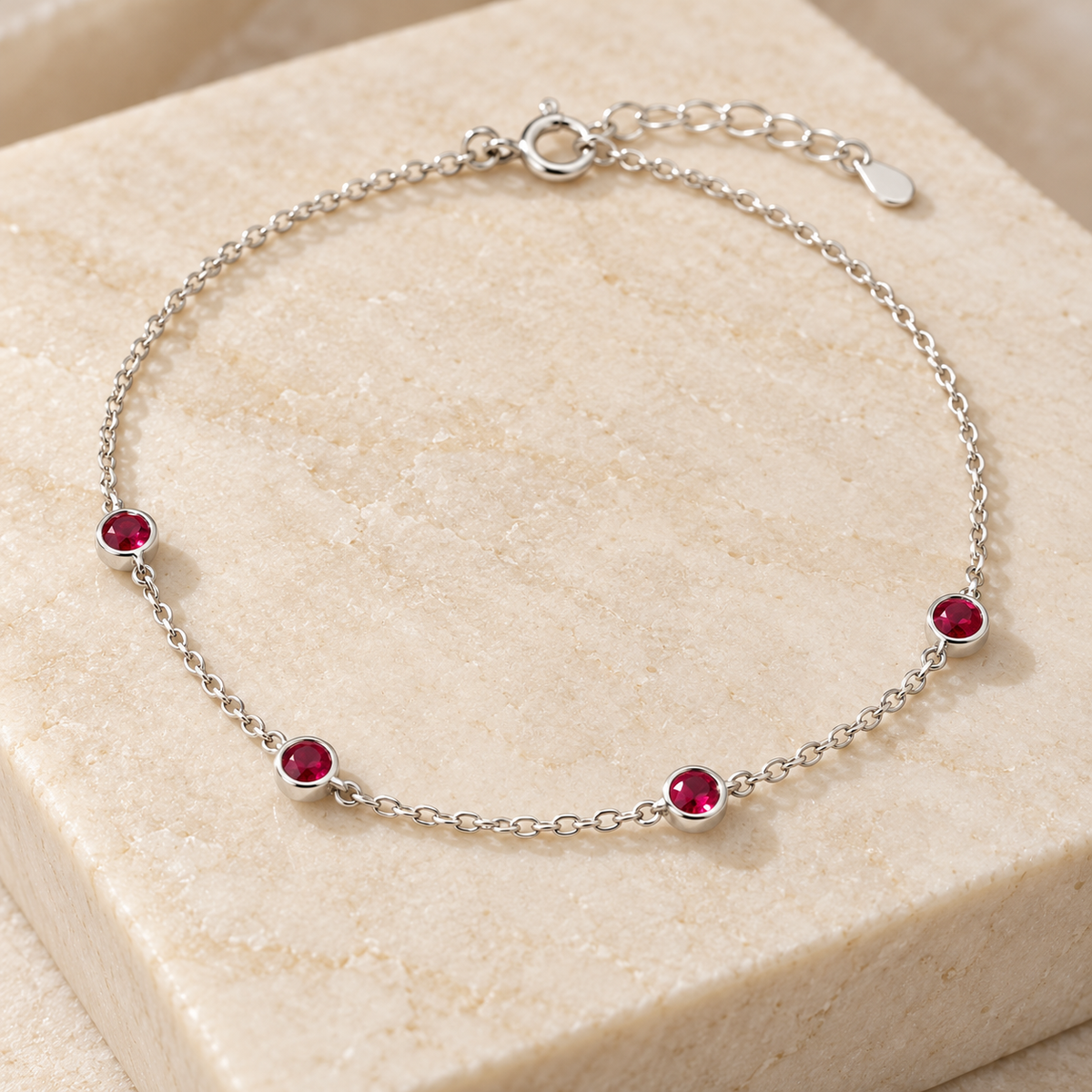 Silver bracelet on cream stone
