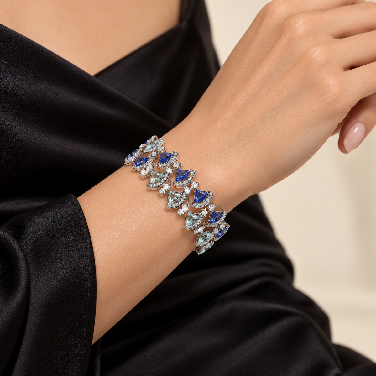 Blue aqua fan link bracelet on party wear model hand