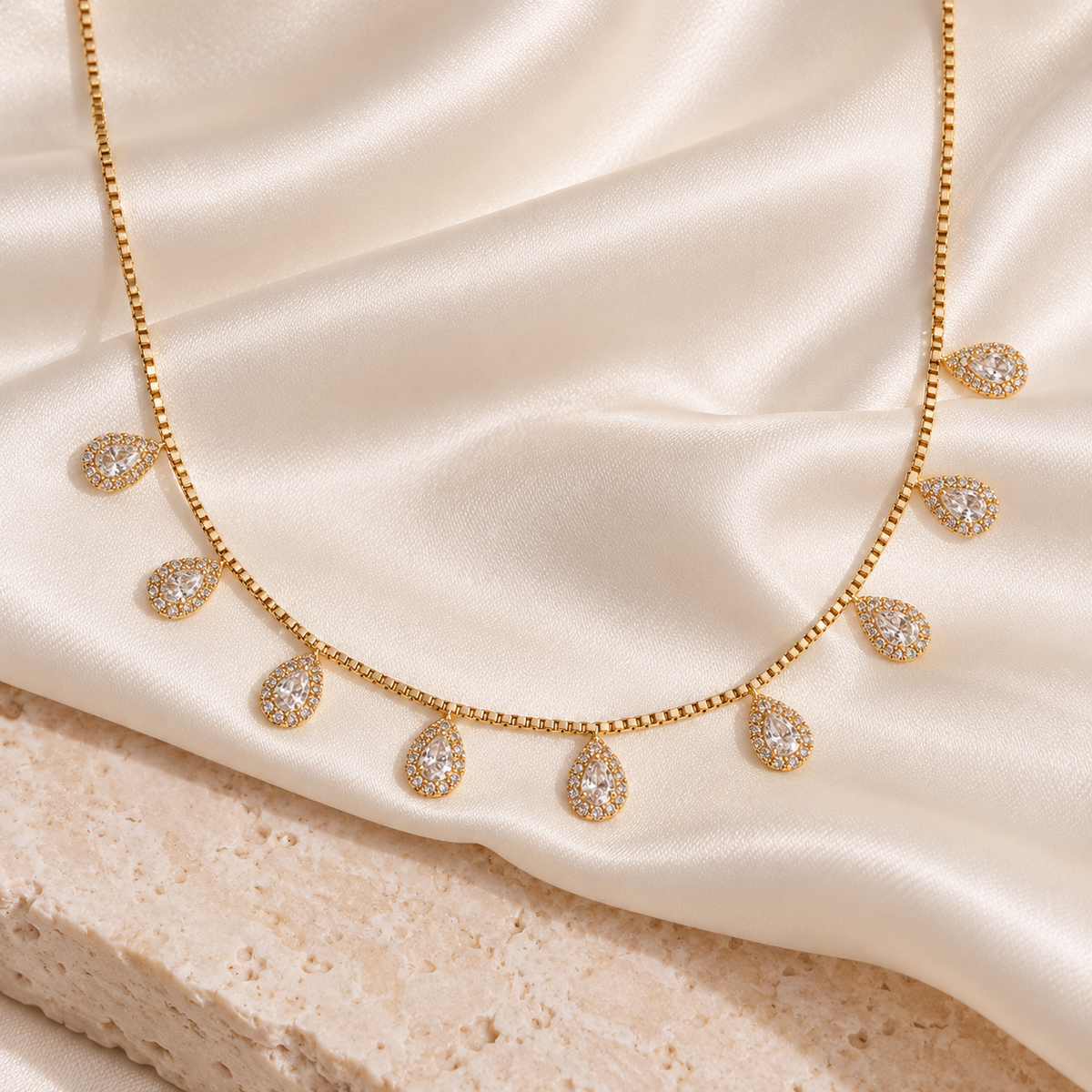 Golden teardrop halo matha patti on ivory satin