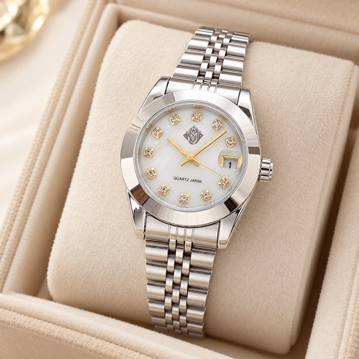 NSJ women's silver watch with small emblem in ivory velvet box