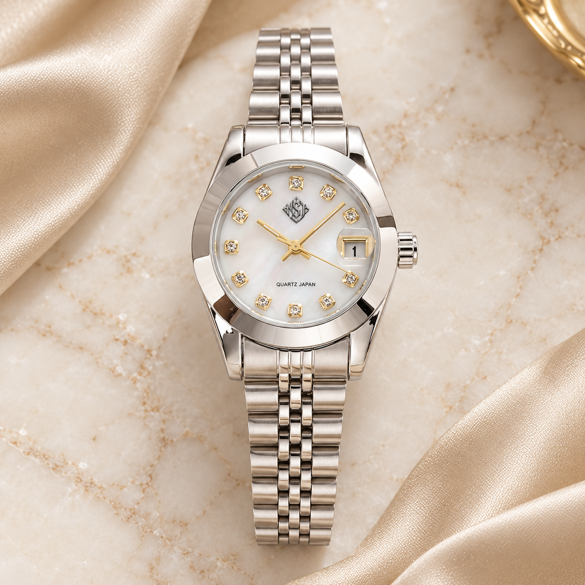 NSJ women's silver watch with small emblem on ivory marble