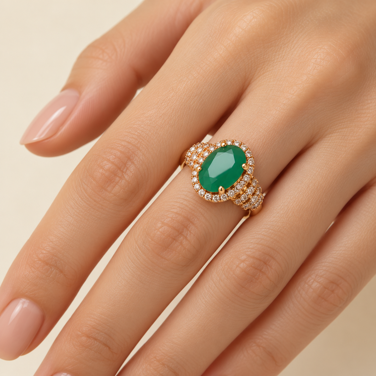 Royal Green Oval Halo Ring on model hand